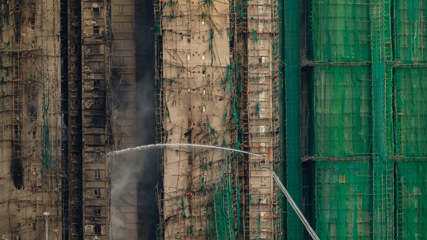 Fire that killed at least 44 still burns in Hong Kong